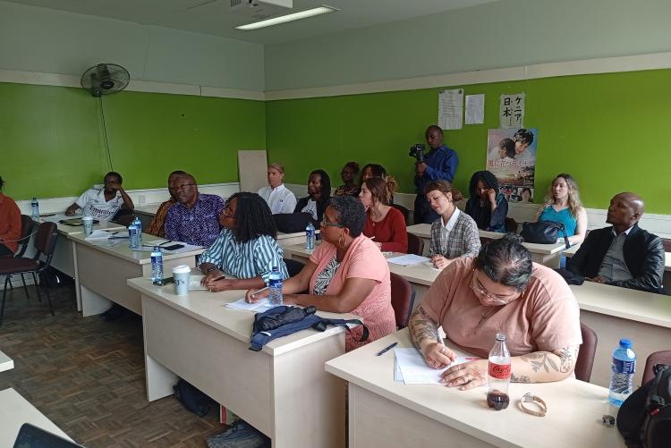 Participants follow the presentations