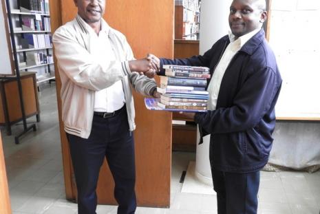 Dr. Osaaji Donating  Books to the JKML Library