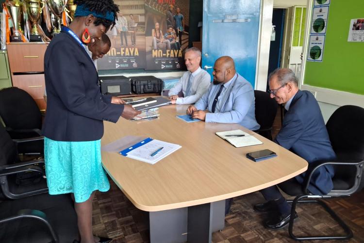 Mayotte university president during the signing of the visitors book 