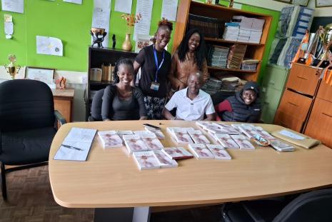 Ag. Chair Dr. Caroline Oyugi poses for a photo  with students 
