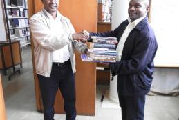 Dr. Osaaji Donating  Books to the JKML Library